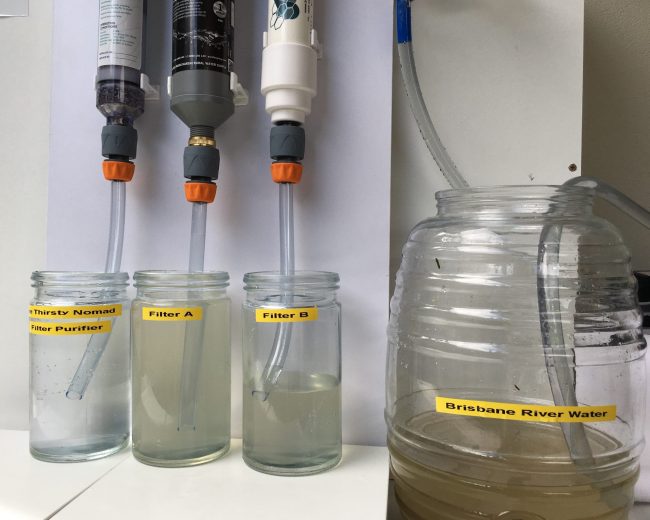 Thirsty Nomad filtered water next to other filters and untreated Brisbane river water